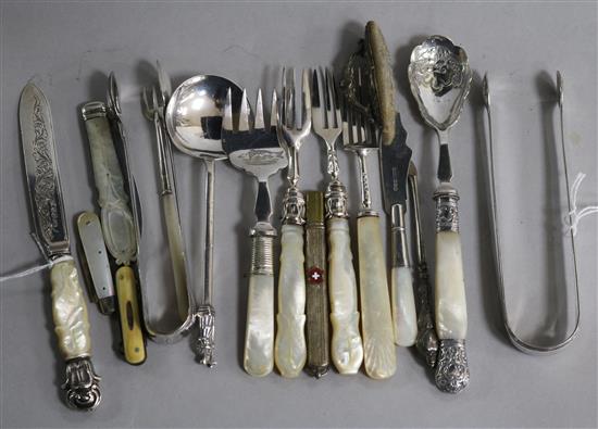 A silver Apostle preserve spoon, two pairs of silver sugar tongs and sundry mother of pearl handled items,